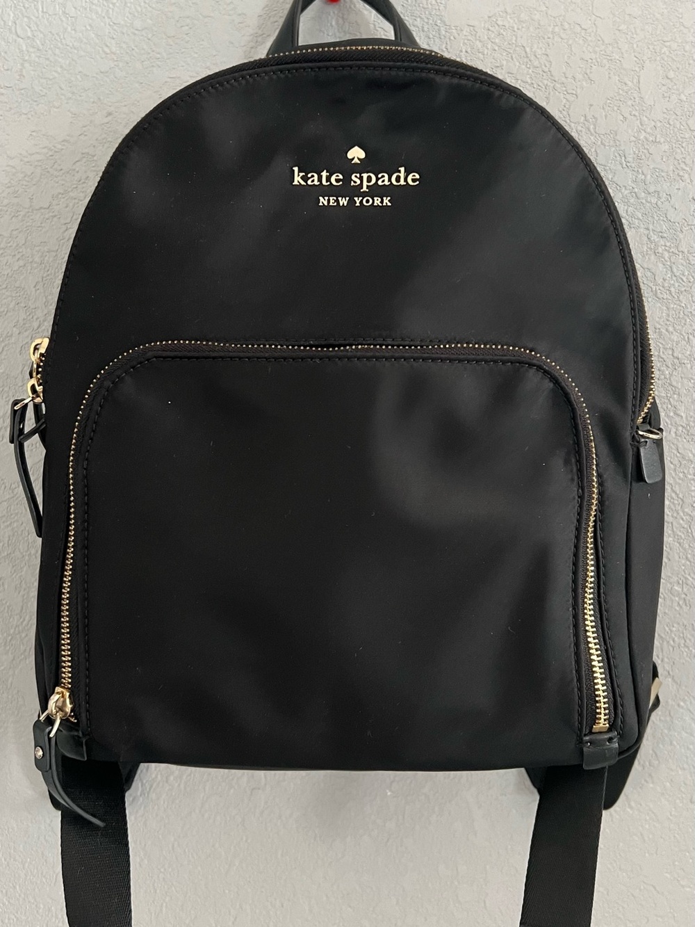 kate spade black nylon backpack with gold logo and zippers